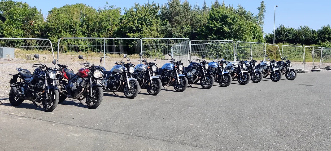 A row of learner motorcycles lined up before a Meath Motorcycle Academy training session